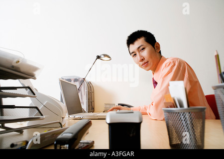 Portrait of a businessman using a laptop Stock Photo