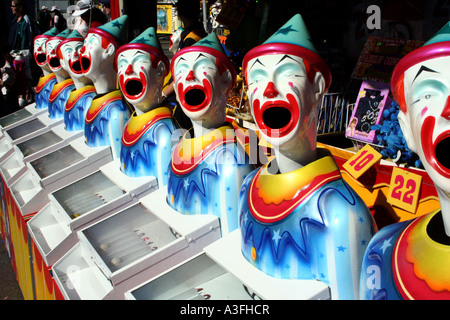 A ROW OF CLOWNS IN SIDE SHOW ALLEY BAPDA8950 Stock Photo