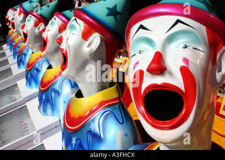 A ROW OF CLOWNS IN SIDE SHOW ALLEY BAPDA8953 Stock Photo