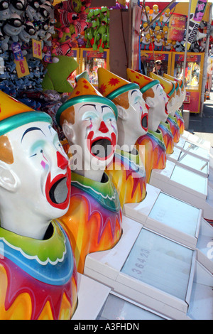 A ROW OF CLOWNS IN SIDE SHOW ALLEY BAPDA8960 Stock Photo