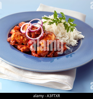 A plate of chicken Madras and rice Stock Photo
