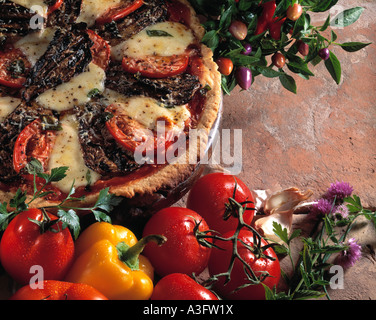 Rustic pizza on terracotta background Stock Photo