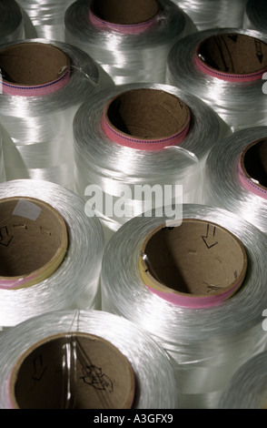 Nylon filaments on spools for use in making rope England UK Stock Photo