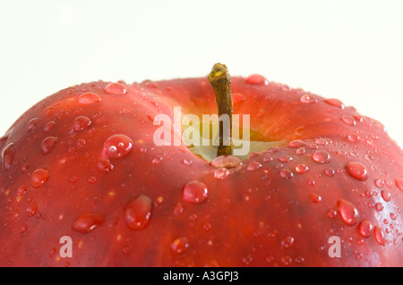 conceptual closeup view of water drops on red apple Stock Photo