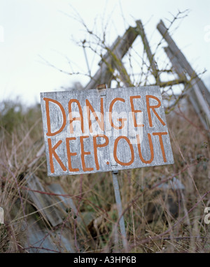 Old danger sign in countryside Stock Photo