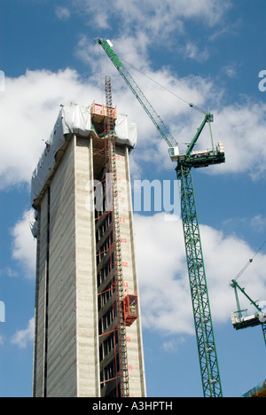Structural concrete core new high rise office block construction building industry site & work platform passenger hoist & crane jib London England UK Stock Photo