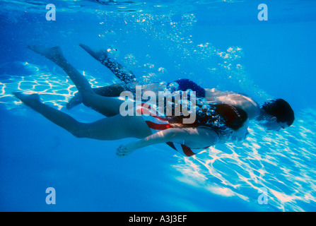 swimmers exploring Florida spring underwater Stock Photo