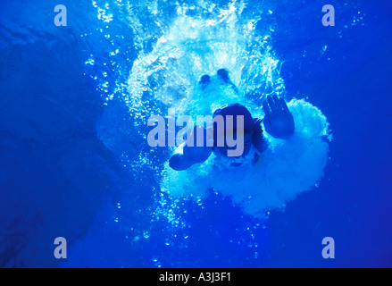 woman diving underwater Stock Photo