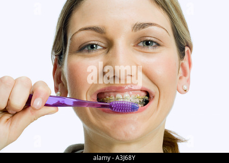 Woman brushing teeth Stock Photo