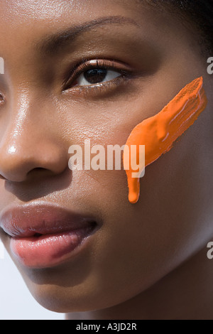 Sunblock on a womans face Stock Photo