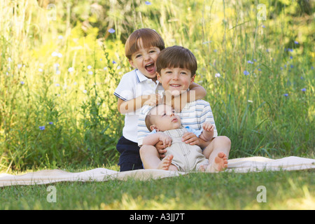 Portrait of Three Brothers Outdoors Stock Photo