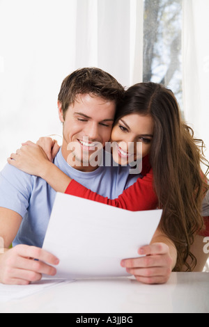 Couple Looking at Document Stock Photo