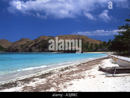 White sands blue  and blue sky at the stunning tranquil and near deserted Tanjung Aan beach and bay South Lombok Indonesia Stock Photo