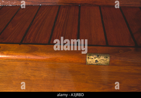 A detail shot of the teak cockpit on an old classic wooden yacht called Cruineag at Port Grimaud in the South of France Stock Photo