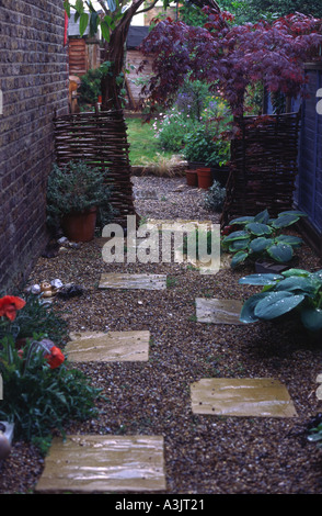 Looking down a back passage garden in a London terrace in Balham Stock Photo