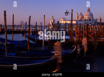 Santa Maria della Salute church Dawn light view from Molo Gondolas in foreground Venice Veneto Italy Stock Photo
