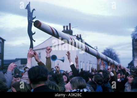 Barwick in Elmit Yorkshire lowering the Maypole once every three years to refurbish. Its good luck to touch the weathervane. 1972 1970s HOMER SYKES Stock Photo