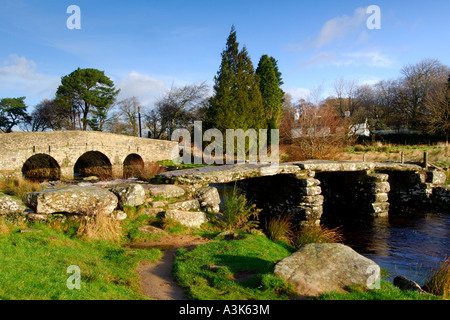 Village of Postbridge Dartmoor showing both the newer stone road bridge crossing and the ancient 14th century clapper bridge Stock Photo