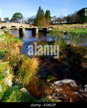 Village of Postbridge Dartmoor showing both the newer stone road bridge crossing and the ancient 14th century clapper bridge Stock Photo