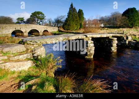 Village of Postbridge Dartmoor showing both the newer stone road bridge crossing and the ancient 14th century clapper bridge Stock Photo