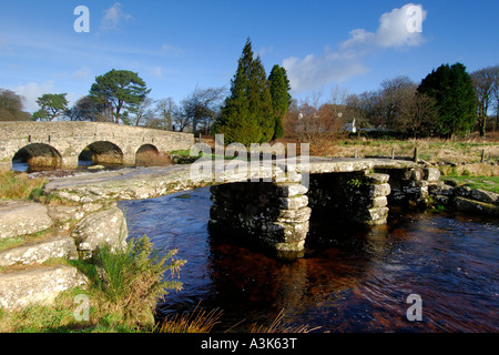 Village of Postbridge Dartmoor showing both the newer stone road bridge crossing and the ancient 14th century clapper bridge Stock Photo