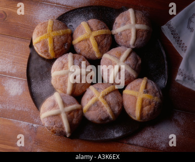 Plate of freshly-baked cinnamon hot-cross doughnuts Stock Photo