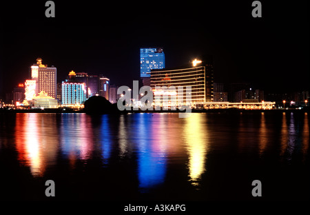 Nightshot of Baia da Praia (Lagos de Nam Van) lined with casinos in the former Portuguese colony of Macau. Stock Photo