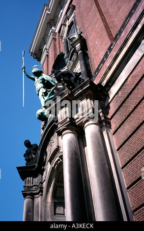 Höllensturz (War in Heaven) depiction above the main portal of Sankt Michaelis church in the German city of Hamburg. Stock Photo