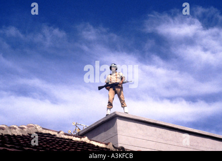 Military policeman standing guard on rooftop during Carneval parade in Barranquilla Colombia South America Stock Photo