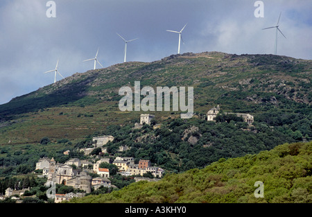 Wind turbines on a mountain top above Rogliano Village, Corsica Island, France. Stock Photo