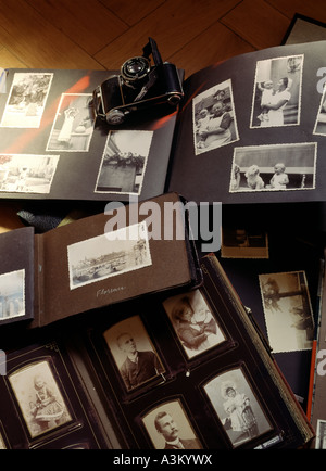Ancient picture albums with family portraits, travel and baby photos Stock Photo