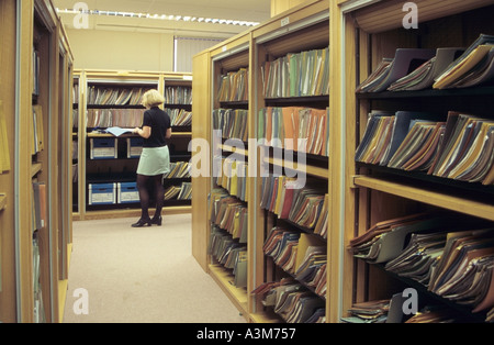 Modern office interior showing filing racks and filing clerk Stock Photo