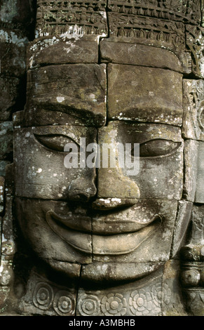 The smile of Angkor. Sculpted from stone, the smiling faces at Bayon temple are a symbol of Angkor, near Siem Reap, Cambodia. Stock Photo