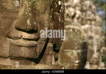 The smile of Angkor. Sculpted from stone, the smiling faces at Bayon temple are a symbol of Angkor, near Siem Reap, Cambodia. Stock Photo