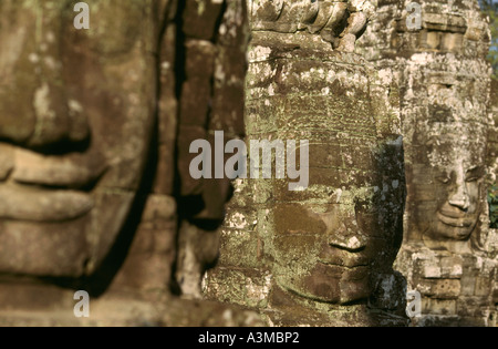 The smile of Angkor. Sculpted from stone, the smiling faces at Bayon temple are a symbol of Angkor, near Siem Reap, Cambodia. Stock Photo