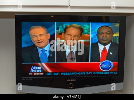 tv screen image of No Spin Zone host Bill o'reilly and guests Fox news Stock Photo