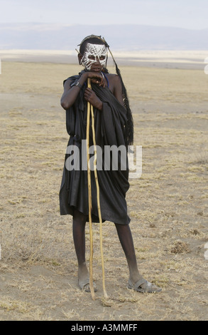 Young recently circumcised Masai Warrior in the Serengei Plains Tanzania Stock Photo