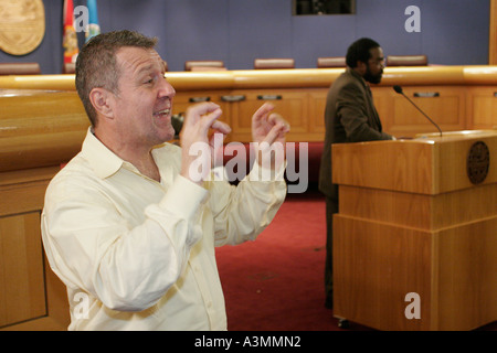 Miami Florida,Government Center,centre,Immigration Summit,White man,male,sign language,bilingual,deaf,hearing,Black Blacks African Africans ethnic min Stock Photo