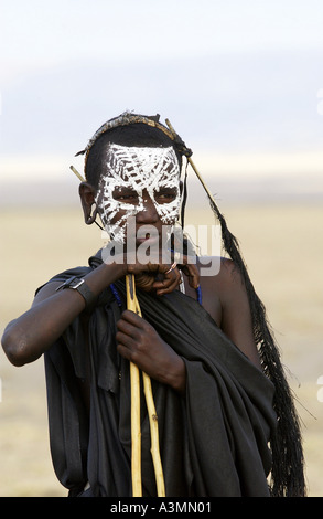 Young recently circumcised Masai Warrior in the Serengei Plains Tanzania Stock Photo