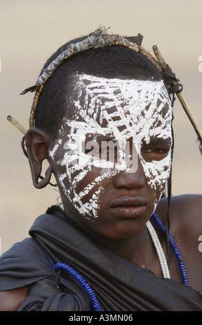 Young recently circumcised Masai Warrior in the Serengei Plains Tanzania Stock Photo