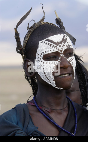 Young recently circumcised Masai Warrior in the Serengei Plains Tanzania Stock Photo