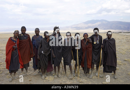 Group of young recently circumcised Masai boys on Serengeti plain Tanzania Stock Photo