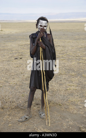 Young recently circumcised Masai Warrior in the Serengei Plains Tanzania Stock Photo