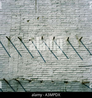 Brick building with steel bars in windows Stock Photo - Alamy