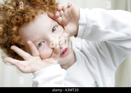 Boy framing for a picture Stock Photo