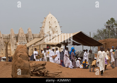 Village worshippers leaving Larabanga Mosque after Friday Prayers, Larabanga, Northern Ghana. Stock Photo