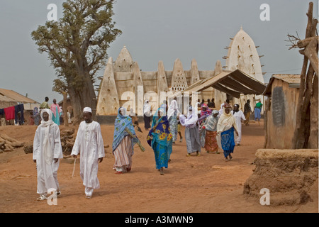 Village worshippers leaving Larabanga Mosque after Friday Prayers, Larabanga, Northern Ghana, Stock Photo