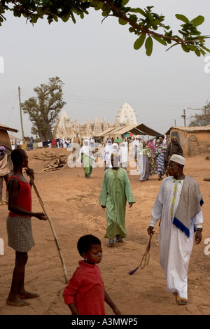 Village worshippers leaving Larabanga Mosque after Friday Prayers, Larabanga, Northern Ghana, West Africa. Stock Photo