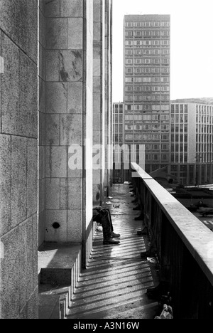 Milan, Italy. A man seated between skyscrapers Stock Photo