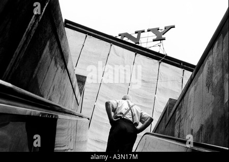 Italy, Milan. Man on metro escalators Stock Photo